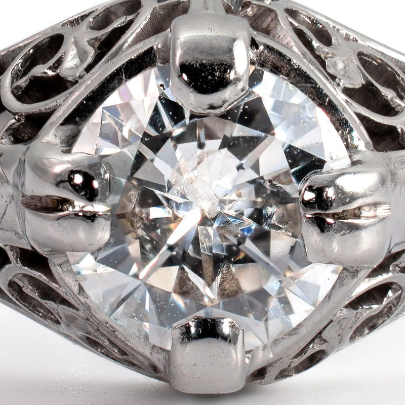 Extreme macro close-up of a transitional-cut antique diamond showing facet pattern and small open culet