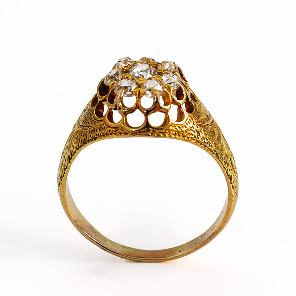 Victorian ring highligting hand engraving pierced gallery and 8 old mine cut diamonds.
