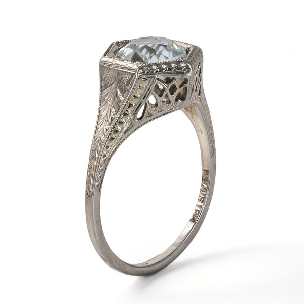 Upright side angle displaying the architectural height, pierced gallery fretwork, and carved foliate shank of the Belais ring.