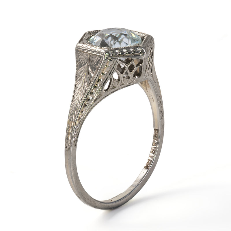 Upright side angle displaying the architectural height, pierced gallery fretwork, and carved foliate shank of the Belais ring.