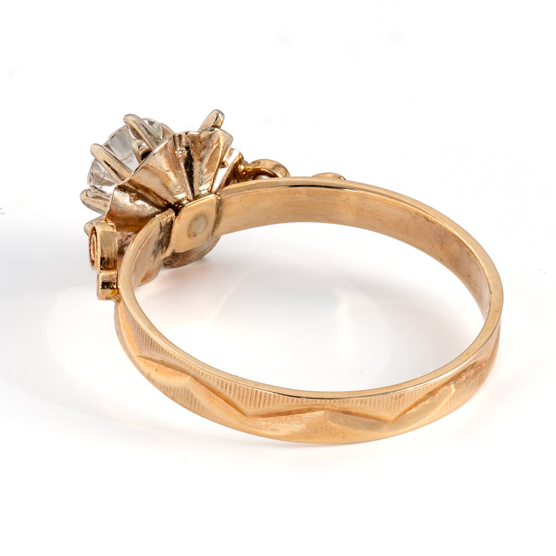 Rear angle view of vintage 14K gold diamond ring showing engraved chevron pattern along the shank