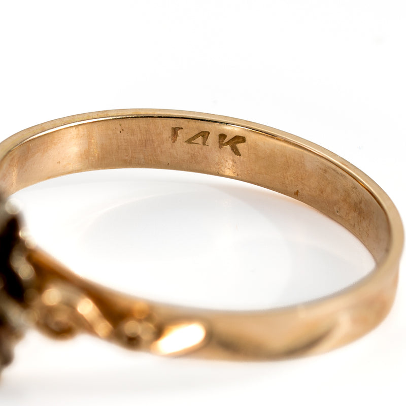 Close-up of authentic 14K gold hallmark stamp inside the vintage ring band