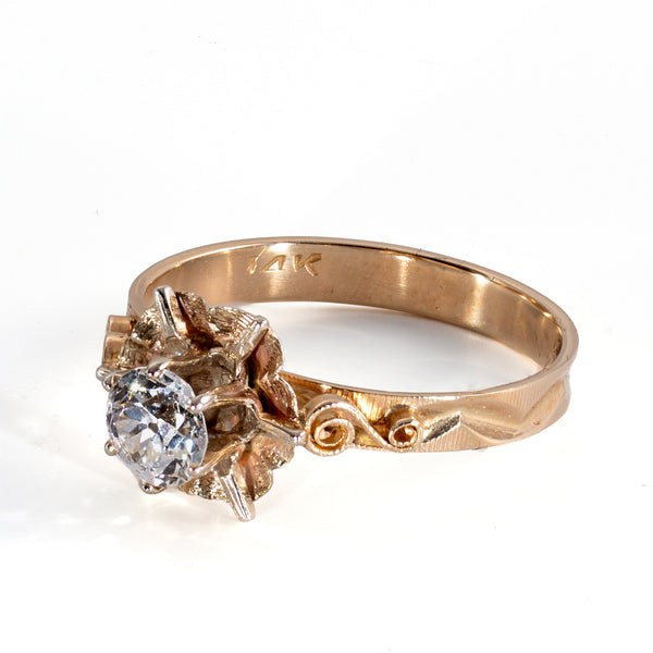 Side view of vintage diamond buttercup ring showing textured petals and dimensional S-scroll shoulders